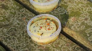 Geitje in de bloemenweelde